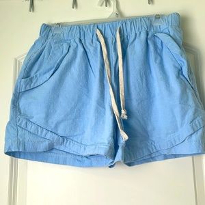 Large light blue 100% cotton shorts with side and back pockets.